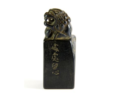 An early 20th century Chinese carved black hardstone seal, H. 8.5cm.