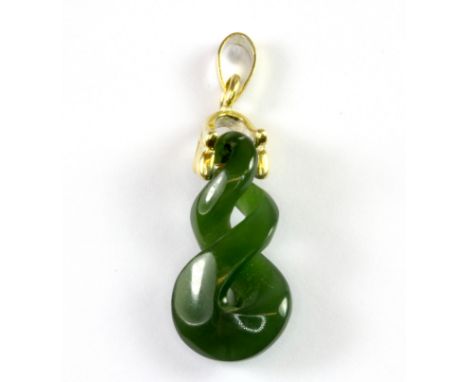 A yellow metal mounted carved jade pendant.