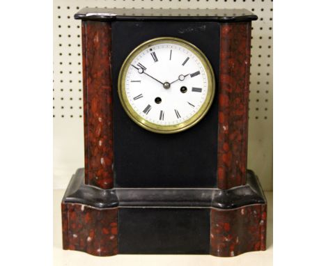 A 19th century French marble and slate mantle clock, H. 33cm.