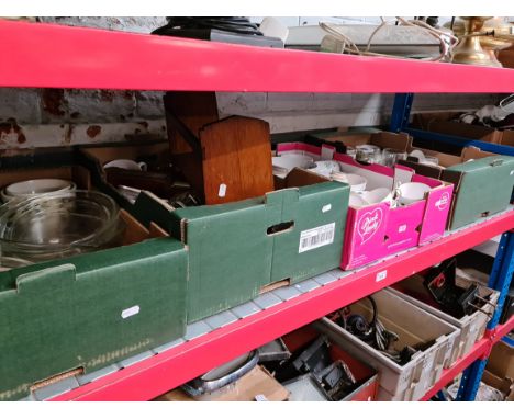 Four boxes of pottery, pyrex ware, barometer, bookrest, etc. 