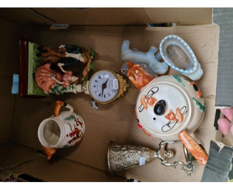 A mixed lot comprising fox hunting teapot and milk jug, glass elephant dishes, figural clock etc. 
