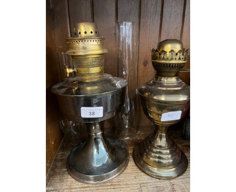 A vintage Aladdin No. 23 paraffin lamp together with a another, both with funnels, no shades. 