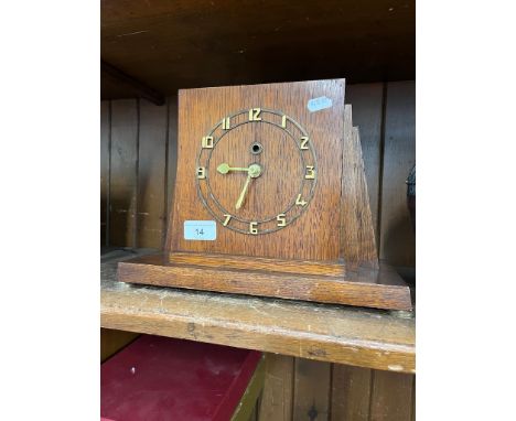 An oak cased Art Deco mantel clock.