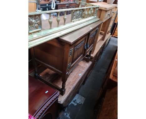 A brass fender, an Old Charm oak side cabinet and an oak drop leaf table with twist legs. 