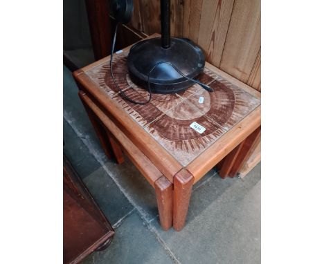 A mid 20th century teak and tile top coffee table and metal standard lamp. 