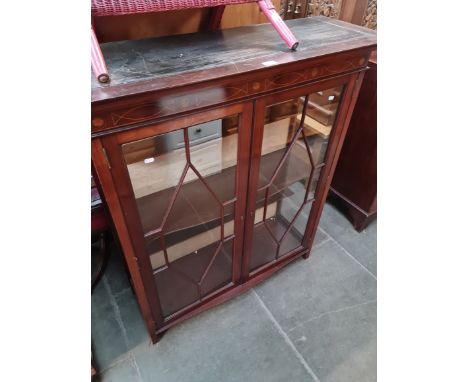 A glazed inlaid mahogany display cabinet. 