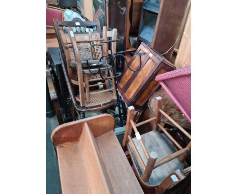 Various items of furniture; a rocking chair, an armchir, child's chairs, a walnut cabinet, a metal candle stand, a nest of ta