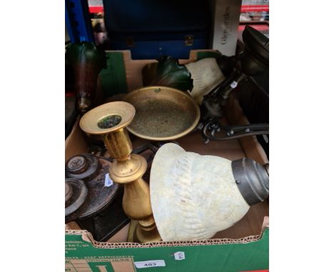 A box containing two metal and glass light fittings, vintage scales and a candlestick. 