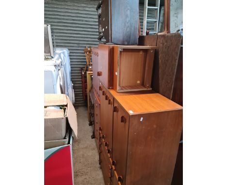 Various pieces of mid 20th century teak furniture including four chests of drawers and a bedside cabinet together with an oak