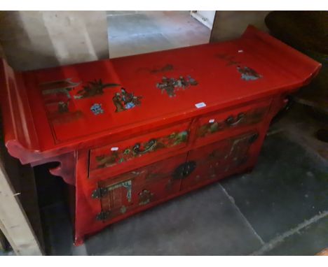 A Chinese red painted side cabinet decorated with eastern figures and flowers. Dimensions- height 73.5cm, length 123cm and de