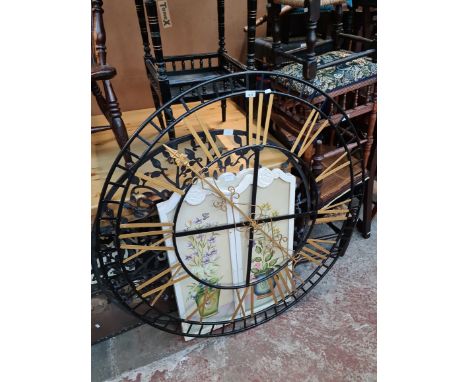 A decorative metal wall art clock face, a decorative metal tree of life and a French style painted firescreen. 