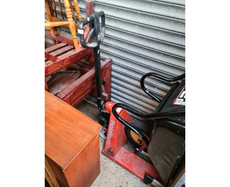 A manual pallet truck. 