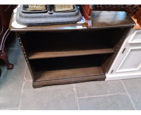 An Ercol dark elm bookcase. 