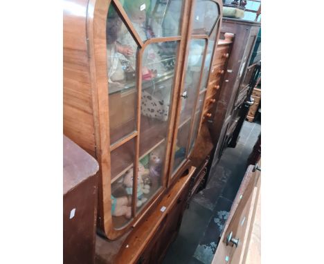 A 1930s Art Deco walnut display cabinet cotaining a number of teddies together with a pine side cabinet. 