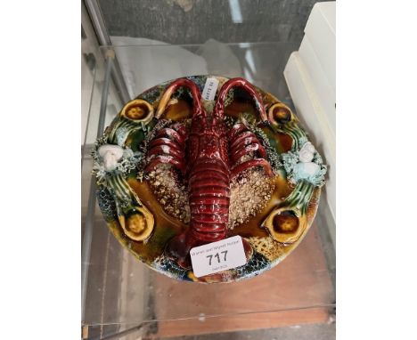 A vintage ceramic wall plaque featuring a 3-D lobster 