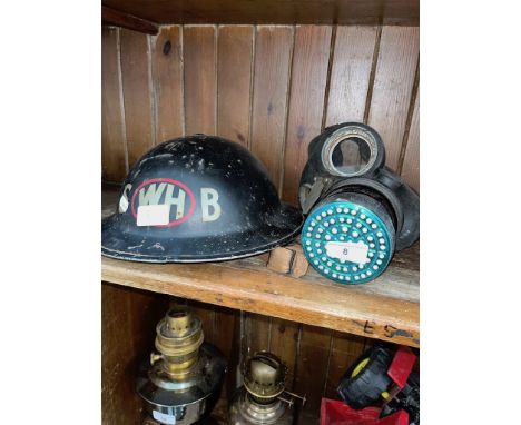 A military helmet and a gas mask. 