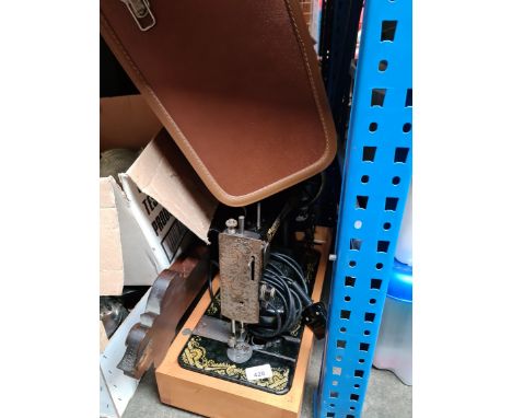 An electric Singer sewing machine with pedal, in case and a barometer - AF. 