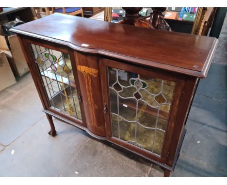 An Edwardian Arts &amp; Crafts inlaid mahogany and leaded glass display cabinet. 