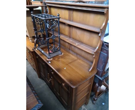 An Ercol 'Golden Dawn' elm dresser with plate rack back. 