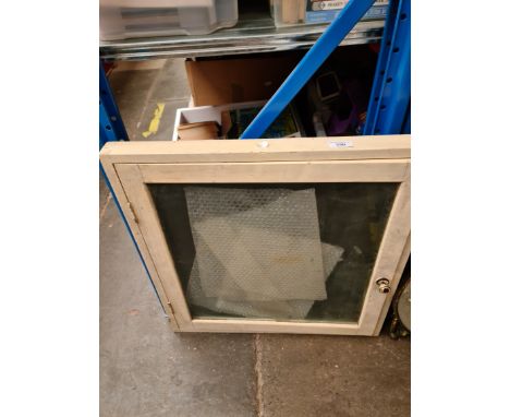 A table top glazed display cabinet. 