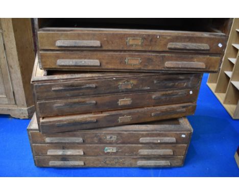 A vintage plan chest in three sections (one drawer missing)
