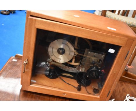 A vintage cased electric timing calendar clock , possibly a regulator having smiths self starting electric motor