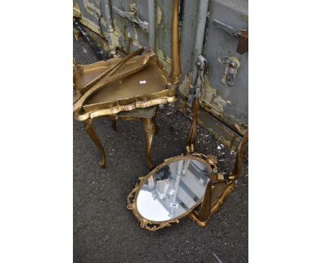 A gilt brass wall mirror and nest of vintage Italian tables