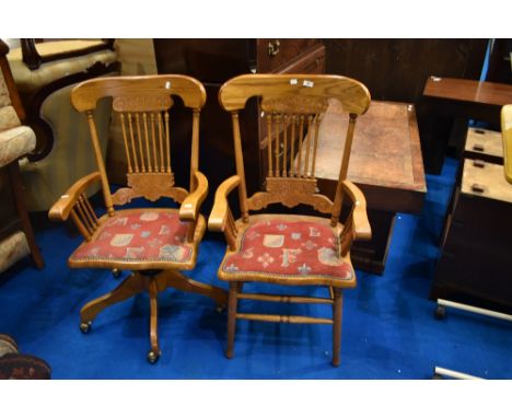 Two vintage stained frame spindle back chairs (armchair and swivel) having upholstered seats