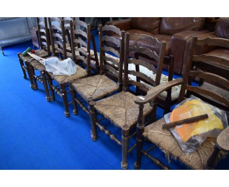 Seven (six plus one) rush seated ladder back chairs