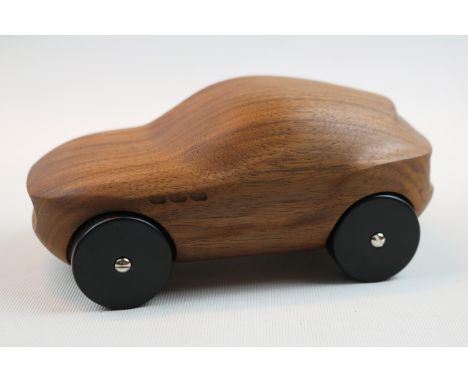 Maserati Levante Walnut with Red button to base. 17cm in Length 