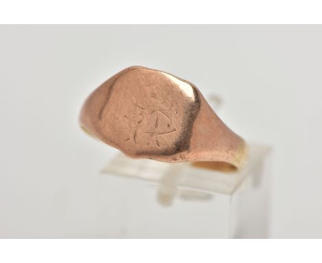 A ROSE GOLD TONE SIGNET RING, shield shape signet with worn engraved initials, misshapen shank stamped 9.375, 9ct, approximat