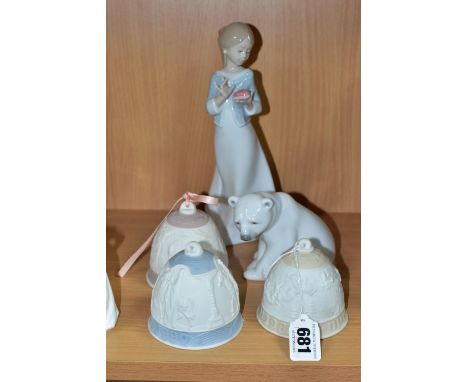 FOUR PIECES OF LLADRO PORCELAIN AND A NAO FIGURE OF A GIRL, the Lladro comprising three Christmas bells dated 1989, 1990 and 