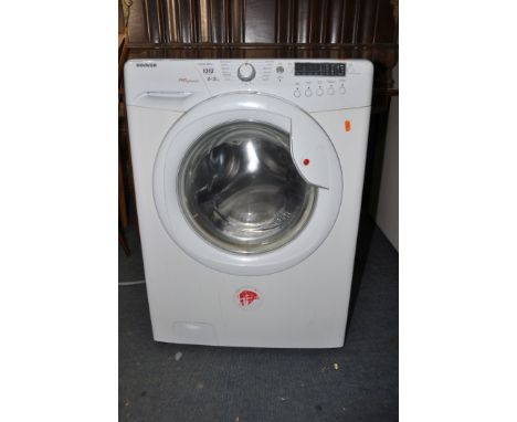 A HOOVER VHW654D washing machine with instruction manual and water pipe (PAT pass and working)