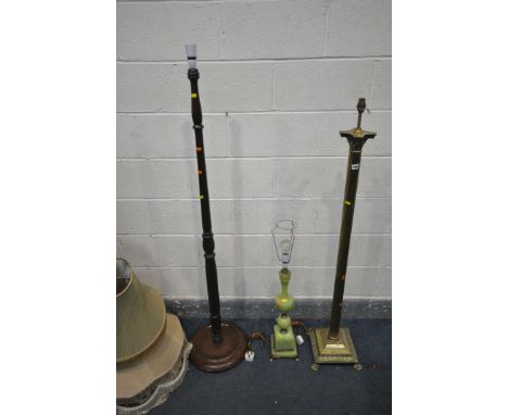 A BRASS CORINTHIAN COLUMN LAMP, an onyx table lamp, another standard lamp, and four various fabric shades (condition - pitted