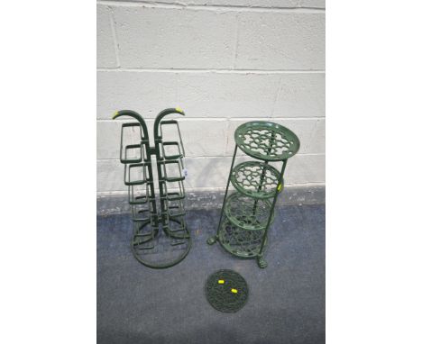 A GREEN PAINTED ALUMINIUM FOUR TIER STAND, along with a steel stand, and a circular trivet (3)