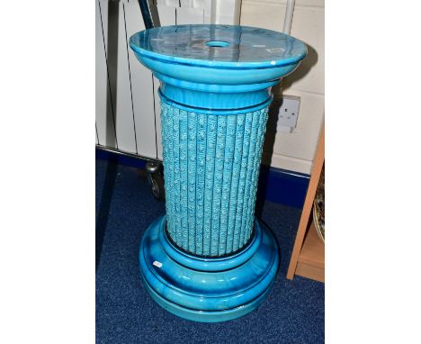 A BURMANTOFTS TURQUOISE GLAZED JARDINIERE STAND, of cylindrical column form, moulded with a seaweed and barnacle effect, impr