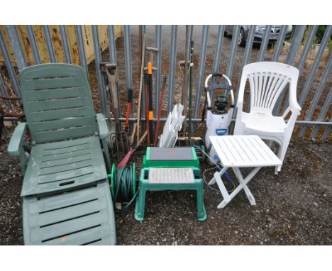 A GREEN PLASTIC GARDEN SUN LOUNGER, two white plastic garden armchairs, three folding tables, along with various garden tools