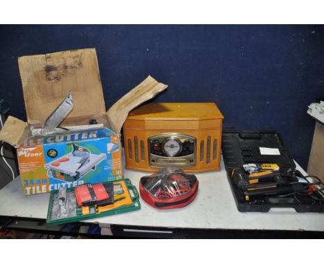 A PRO USER TC1 TILE CUTTER in box with accessories along with a JML PowerTrack E1835A staple/nail gun (both PAT pass and work