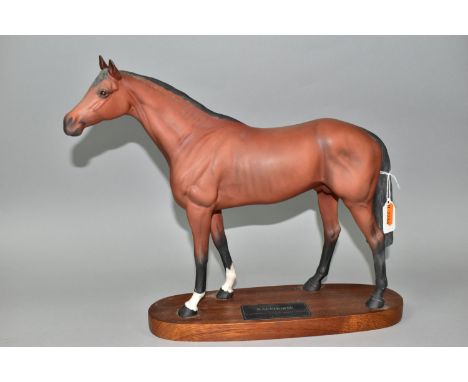 A BESWICK RACEHORSE FIGURE, no 1564, brown matt finish, on an oval wooden plinth labelled 'Racehorse, A Connoisseur Model By 