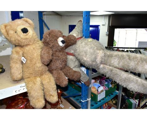 A LARGE STANDING RABBIT SOFT TOY, playworn condition, off white fur with faded red velvet dungarees, hand and foot pads and i