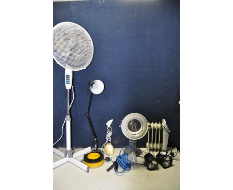 A SELECTION OF LIGHTING to include two garden flood lights, a magnifying lamp, a clip on hand lamp along with a 16in standing