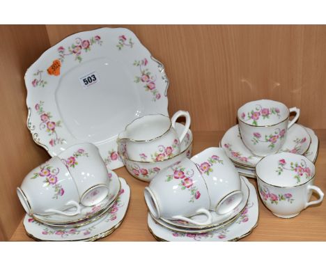 A TWENTY ONE PIECE ROYAL ALBERT WILD ROSE TEA SET, comprising a cake plate, a cream jug, a sugar bowl, six tea cups, six sauc