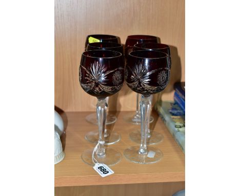 A SET OF SIX RUBY FLASH CUT HOCK GLASSES, on a tapering hexagonal stem with cut edges, circular foot with cut detail, height 