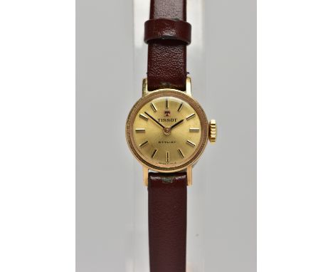 A 9CT GOLD 'TISSOT' WRISTWATCH, hand wound movement, round gold dial signed 'Tissot stylist', baton markers, black hands, wit