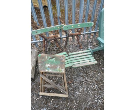 A SET OF THREE COALBROOKDALE STYLE CAST IRON BENCH ENDS AND CENTRAL SUPPORT, along with a vintage slatted folding chairs and 