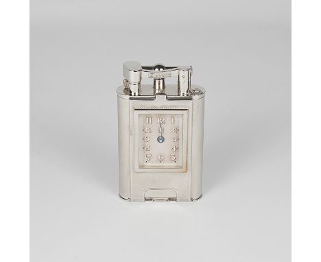 A very good and large Dunhill table lighter of tall rectangular form with engine turned decoration to the body and a clock in