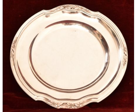 Silver, A French silver serving dish or platter by Tetard Freres, Paris, of circular plain form with foliate designs to the b