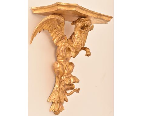A 19th Century carved giltwood wall bracket modelled as a griffin. H=44, W=34cm