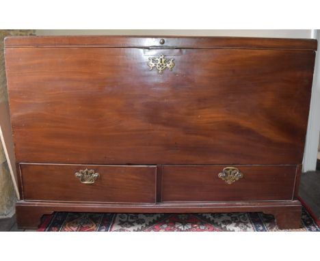 An 18th Century Georgian mahogany mule chest, standing on four shaped bracket feet, with two drawers, with plain front, sides