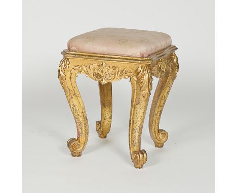 An antique French gilt and gesso carved stool with scrolling feet, cabriole type legs, and acanthus leaf decoration, pink tap